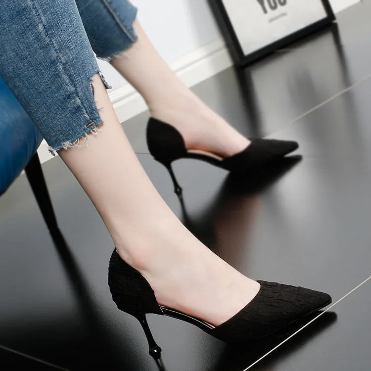 Women's black pointed toe stiletto high heels with a PU upper on a white background.
