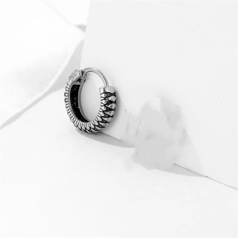 Silver geometric earrings with circular striped design in titanium steel
