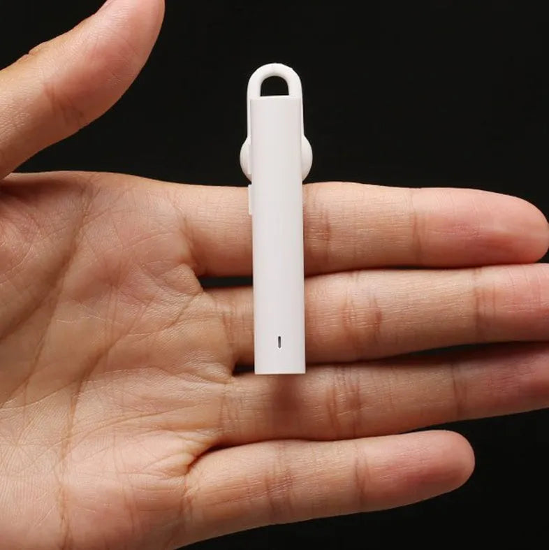 Compact black and white wireless Bluetooth V4.1 headset earpiece showing scale.