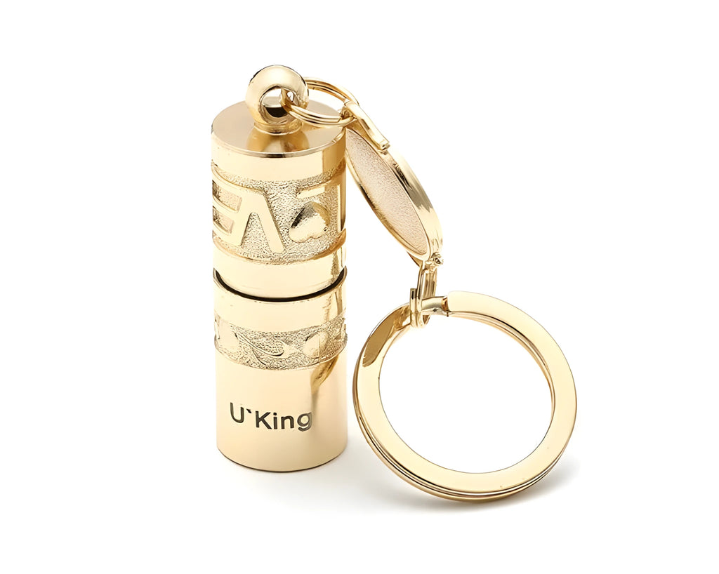 Gold zinc alloy waterproof mini LED flashlight on a keychain ring.