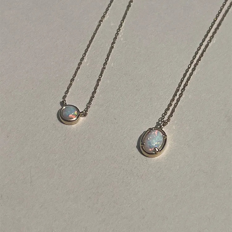 Oval geometric jelly opal pendant necklace with silver plating in gold or white gold colour.