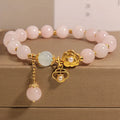 Women's pink crystal flower bracelet with adjustable fit on wrist