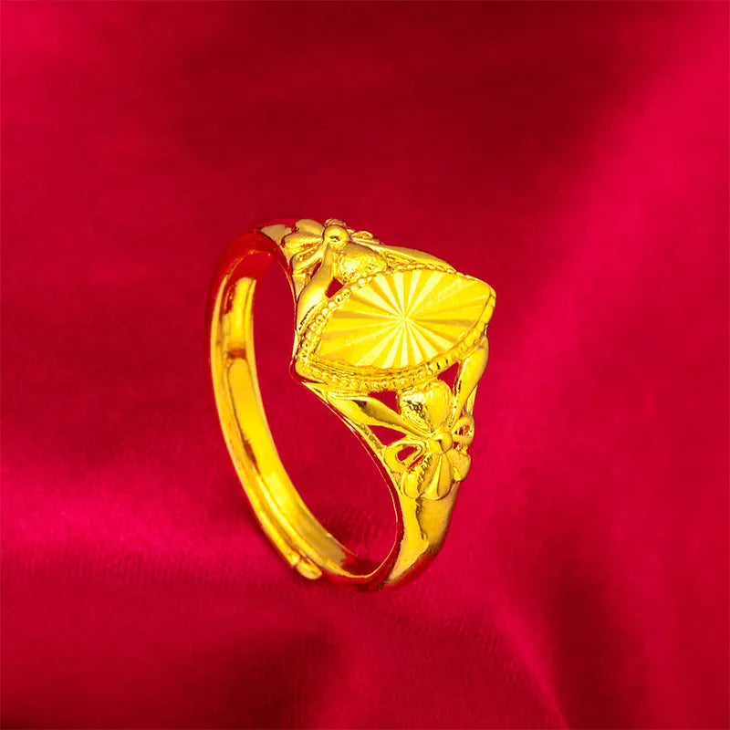 Gold coloured brass ring with open diamond flower design and geometric textured shape
