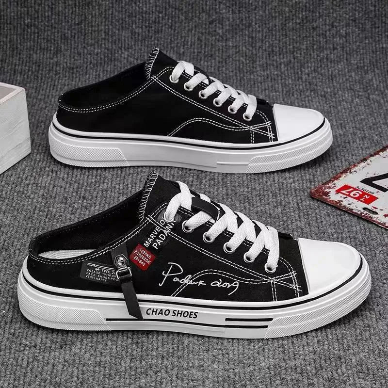 Men's black canvas slip-on casual shoes with round toe and PVC sole.
