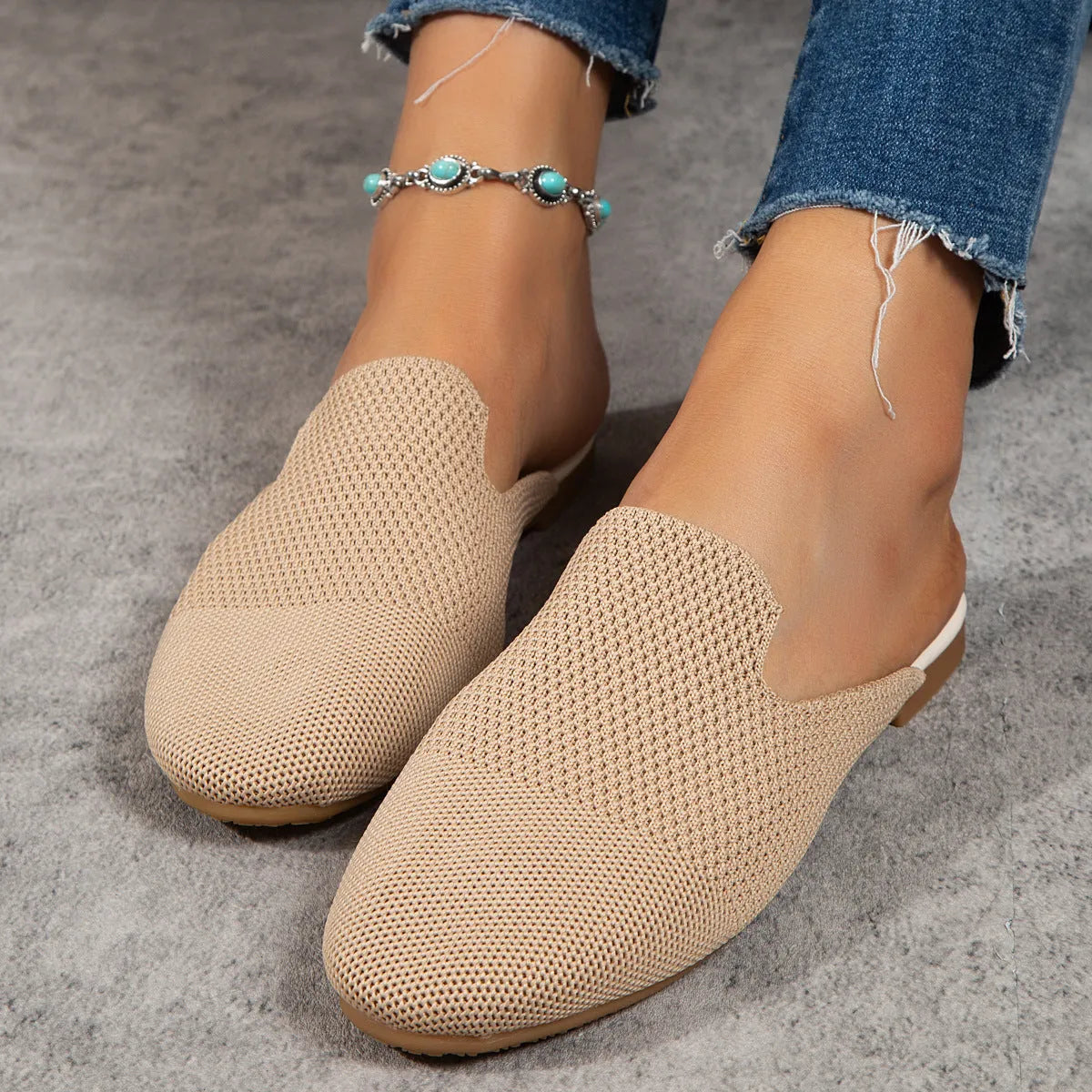 Apricot, blue, and green mesh slip-on flat sandals with round toe and cloth upper.