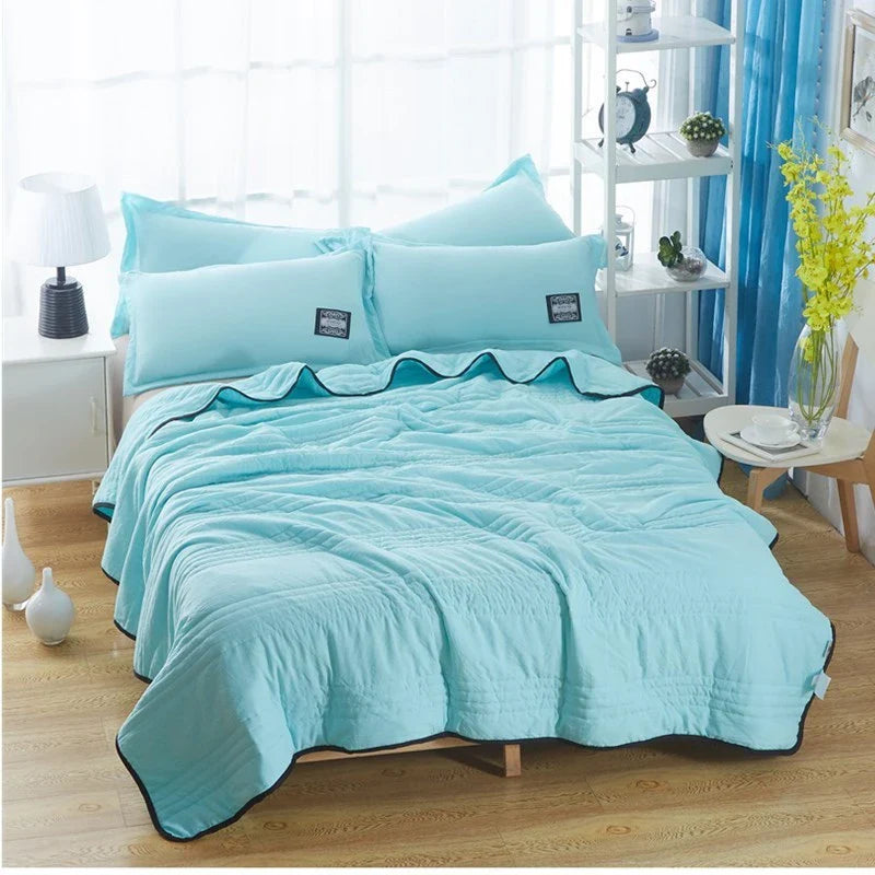 Lightweight, breathable cooling comforter in various colors and sizes for comfortable summer sleep