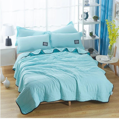 Lightweight, breathable cooling comforter in various colors and sizes for comfortable summer sleep