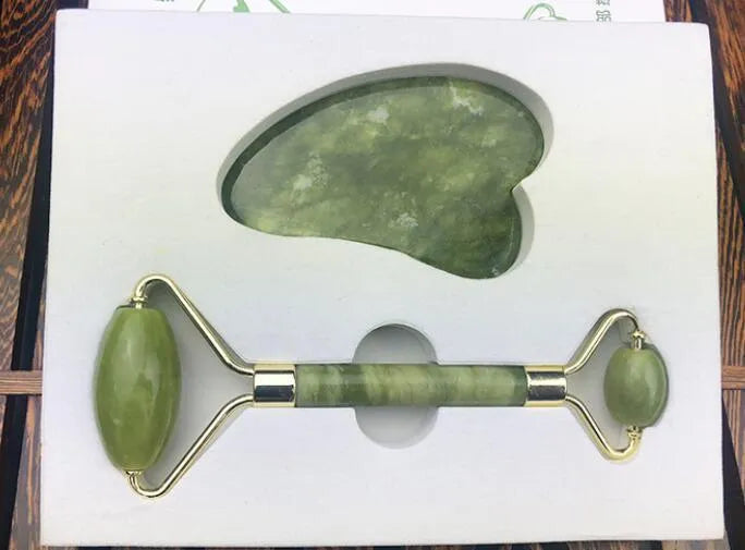 Jade roller massager with rose quartz gua sha stone, dual-sided natural jade facial tool for tension relief and skincare absorption.