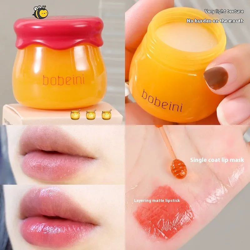 Honey pot style lip balm in 9g size with small application brush, shown in blueberry or pomegranate flavour.