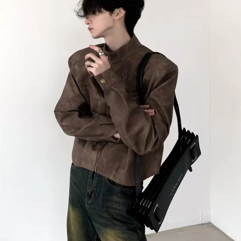 Men's retro brown PU leather short coat with tight fit and long sleeves on a plain background