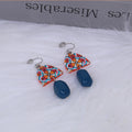 Retro yellow and blue acrylic earrings with irregular geometric shape and electroplated finish, one pair