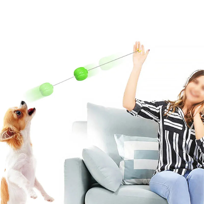 Green, orange, and yellow plastic pumpkin-shaped dog ball with squeaker for small dogs.
