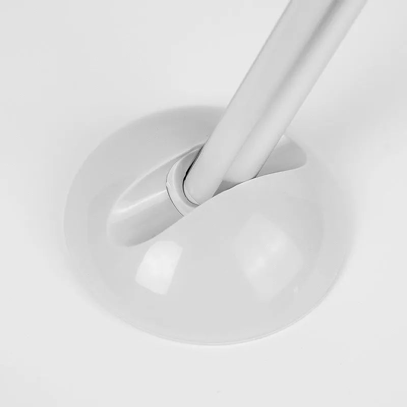 White plastic LED night light with remote control on a cabinet door.