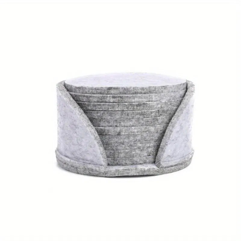 Round felt coaster set of 10 heat resistant drink mats in black, brown, dark gray, and light gray on a wooden table
