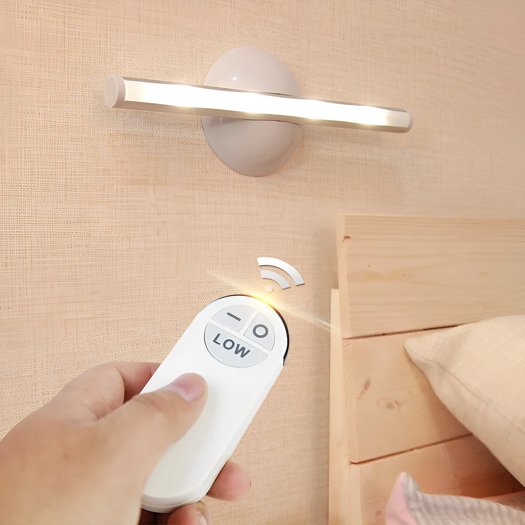 White plastic LED night light with remote control on a cabinet door.