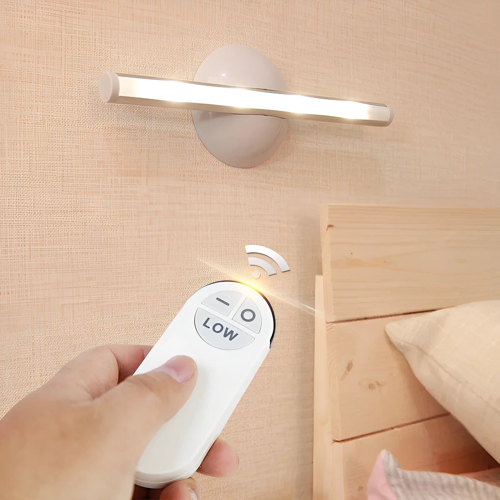 White plastic LED night light with remote control on a cabinet door.