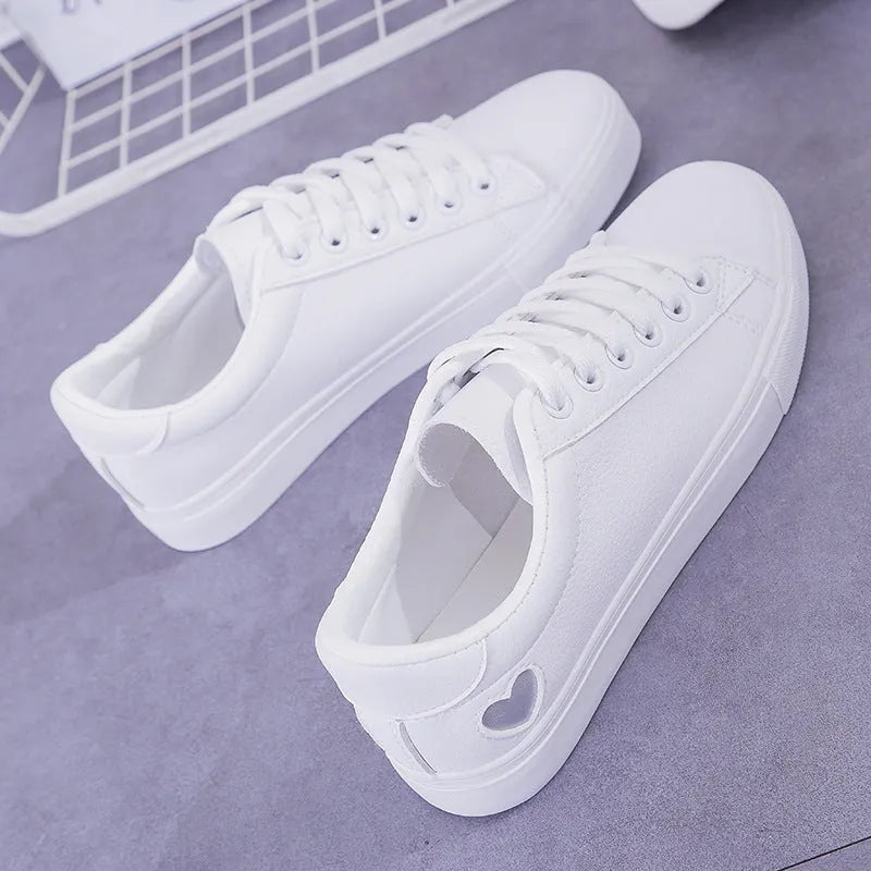Women's PU leather heart flats shoes with colourful beads and stainless steel pendant on white background