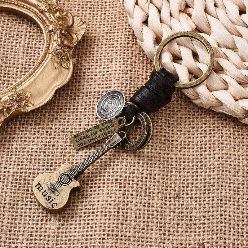 Alloy guitar keychain pendant with cowhide woven charm in retro design