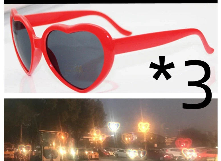 Heart-shaped glow-in-the-dark sunglasses in various vibrant colors, featuring a durable plastic frame and resin lenses for reliable UV protection.