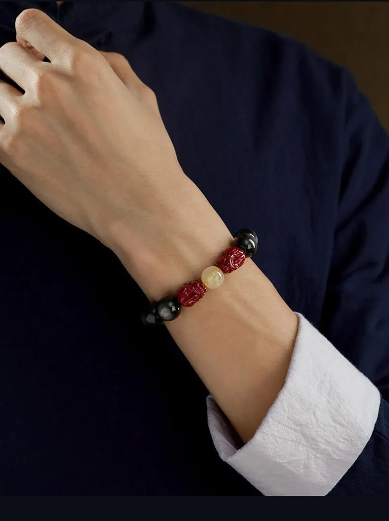 Carved cinnabar bead bracelet with animal zodiac designs in gold or silver colour