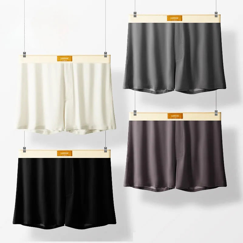 Pack of three pairs of men's solid colour loose fit ice silk nylon underwear on a white background.