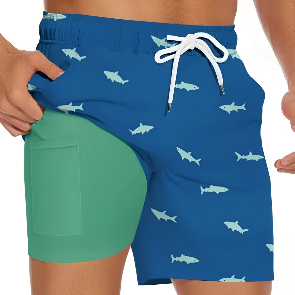 Men's black shorts with a white shark graphic print and a white drawstring waist.