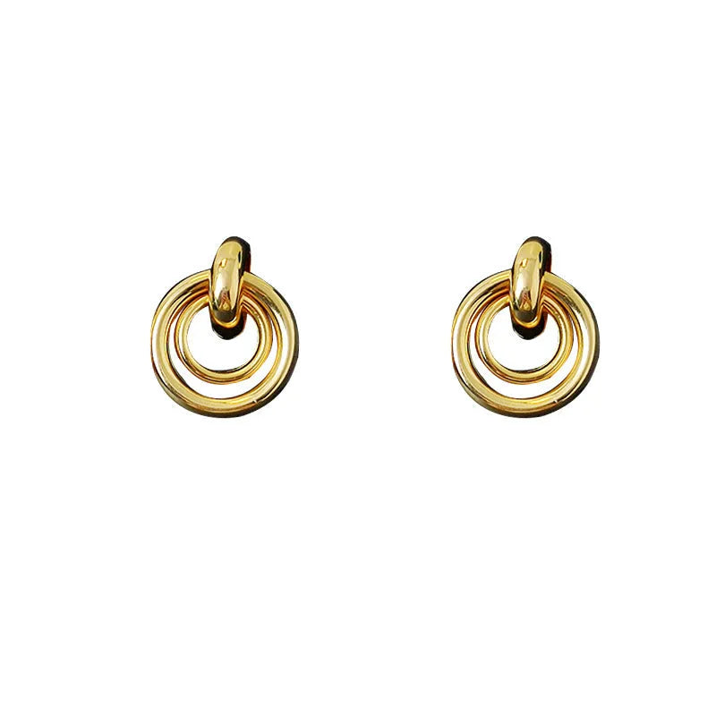 Geometric irregular round ring earrings in electroplated gold colour with exotic style mixed material construction