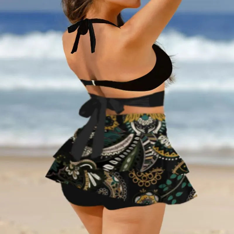 Women's purple high-waisted bikini swimsuit with skirt and lace-up back detail
