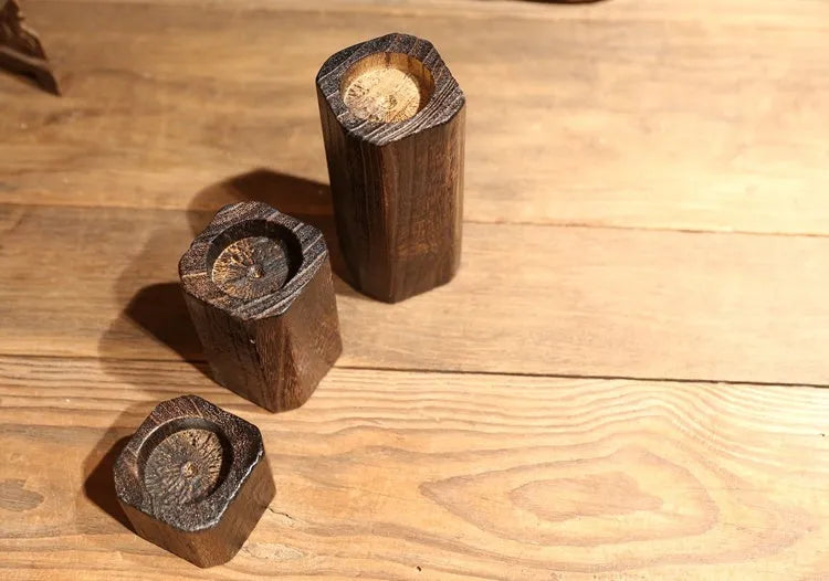 Solid wood candle holder in natural paulownia with charcoal-fired finish, 6x6cm top and 4.5cm candle aperture.