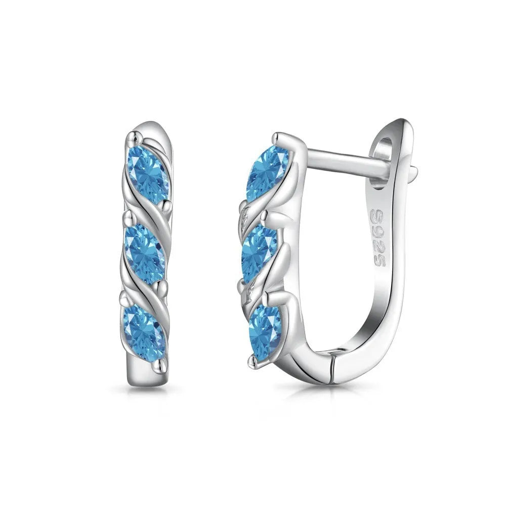 Women's blue zircon inlaid symmetrical earrings in 925 silver with electroplated platinum blue diamond colour, 3x14x15mm.