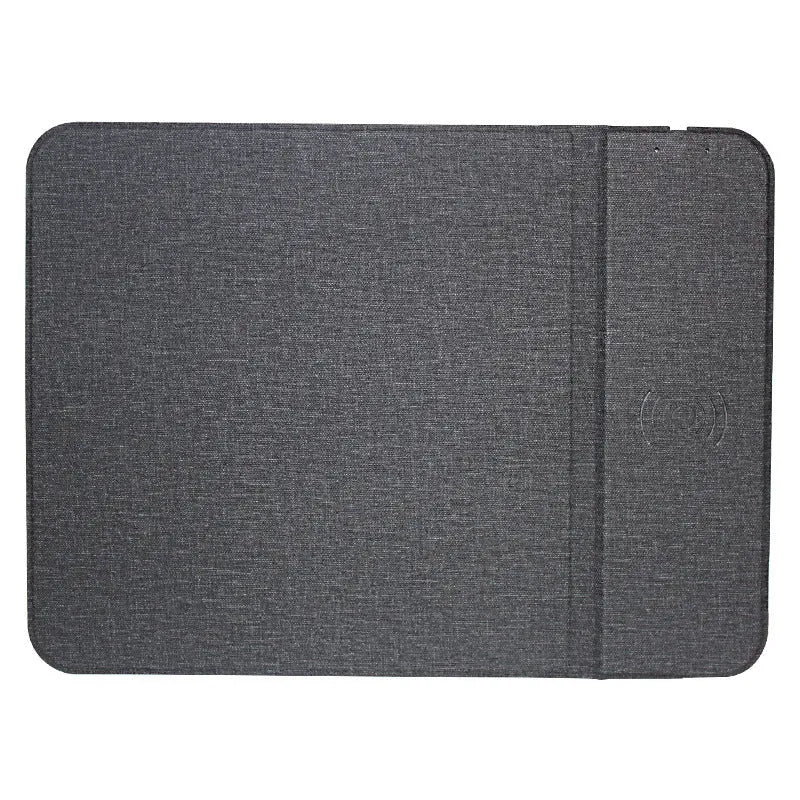 Black 2-in-1 wireless charging mouse pad on a desk with a phone resting on the built-in bracket