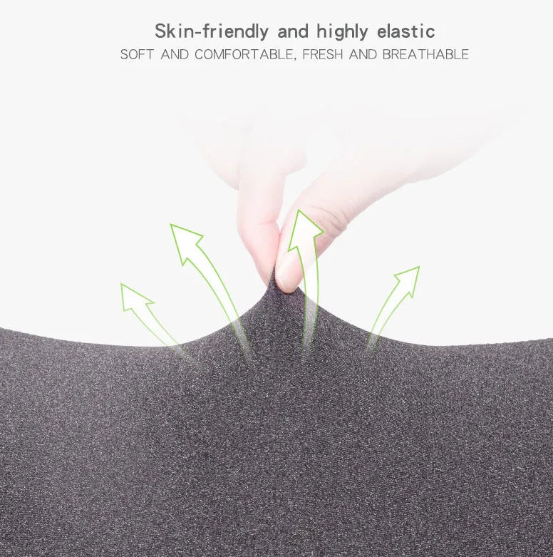 Dark grey car neck memory pillow on a headrest showing its simple rectangular shape.
