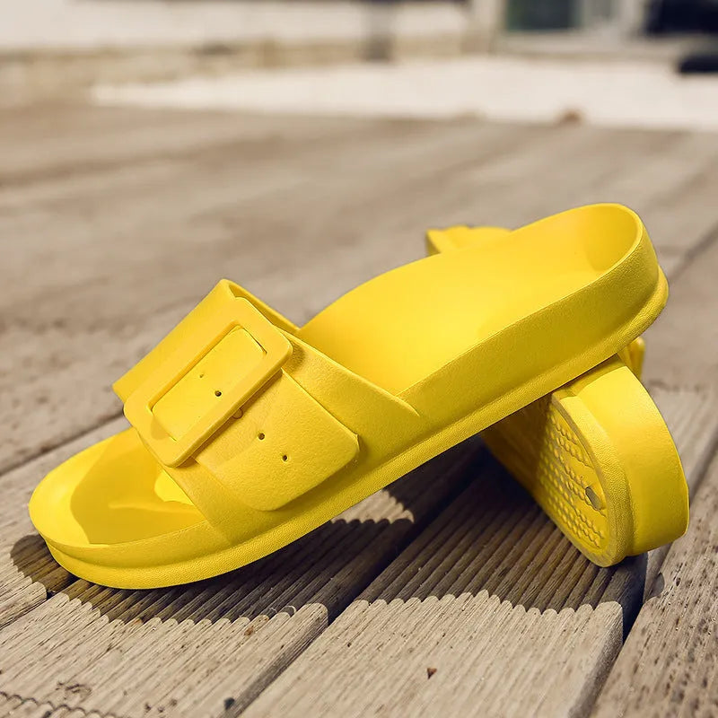 Women's grey blue flip-flop slippers with a buckle strap and soft EVA sole on a light background.