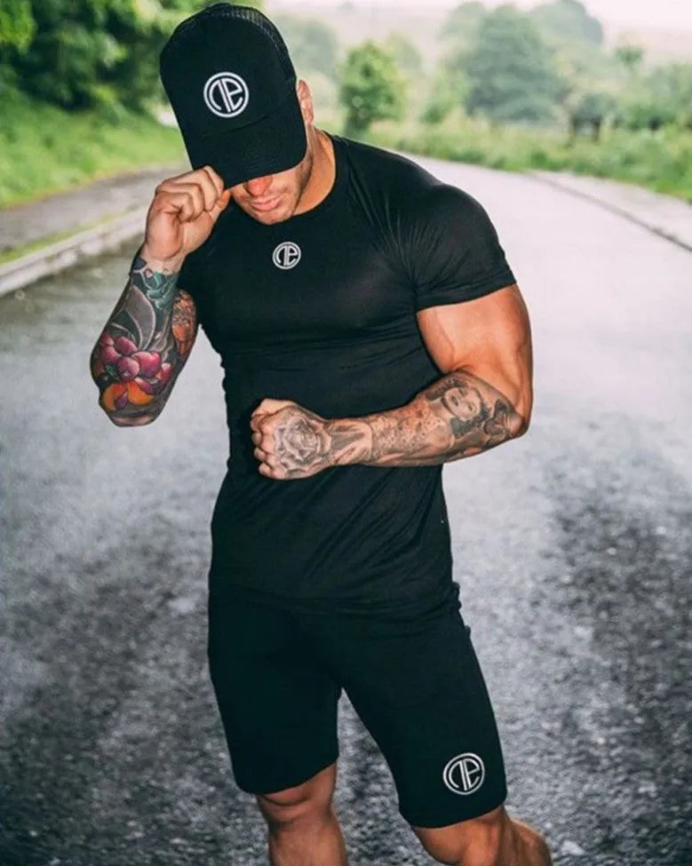 Men's cotton five point running shorts in black with elastic waistband