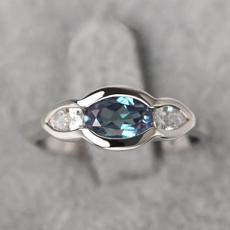 Women's geometric ellipse ring with inlaid zircon stones in white gold finish on copper