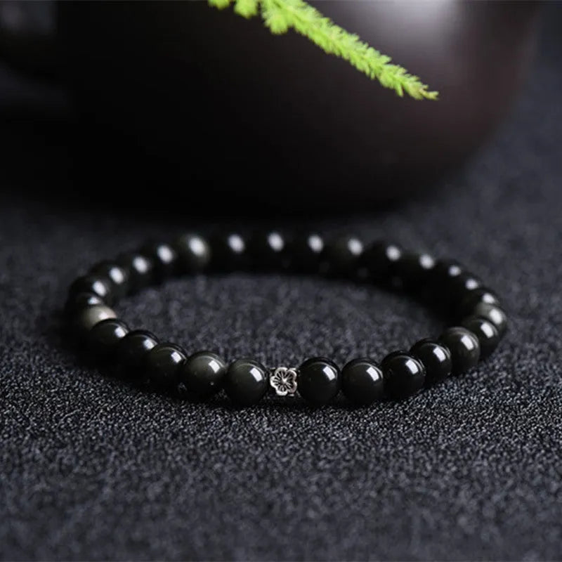 Natural obsidian bracelet with S925 silver flower accessories showing 6mm constellation design and dragon phoenix decorations