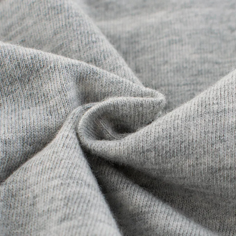 Grey cotton children's t-shirt shown with a size chart listing measurements from 90cm to 140cm.