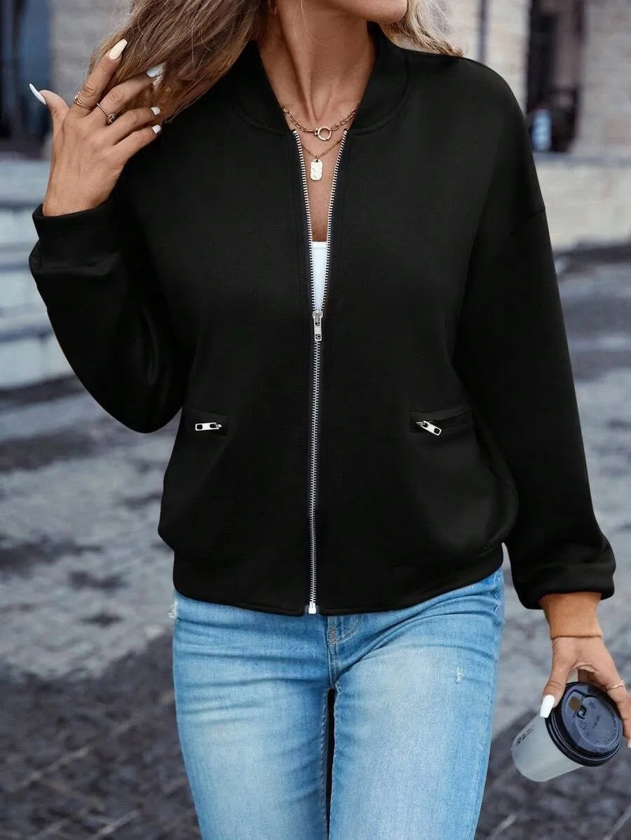 A black women's long sleeve zip-up casual jacket with faux pockets.