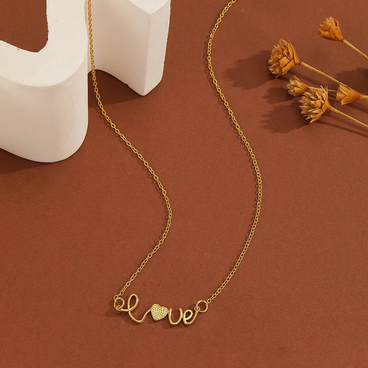 Gold plated copper infinity symbol pendant necklace with sparkling diamond inlay and gold fine chain