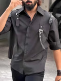 Black men's button-up shirt with regular fit on mannequin showing front button closure