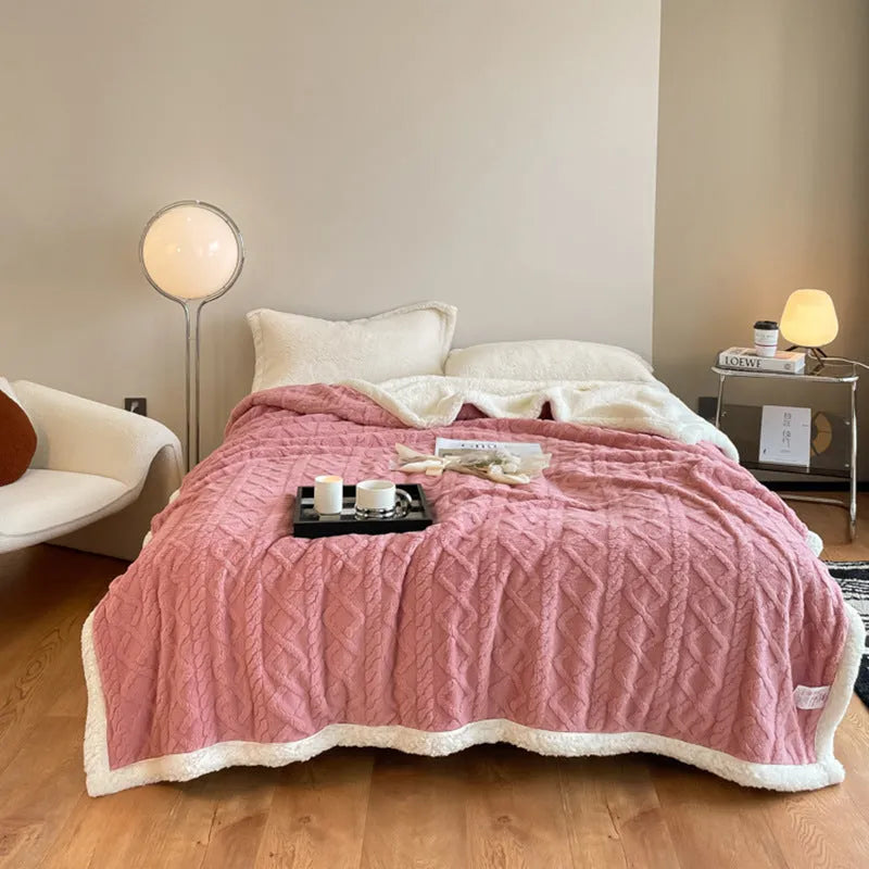 A thick taffeta thermal flannel blanket for winter, shown in one of nine colours on a bed.