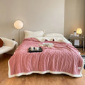 A thick taffeta thermal flannel blanket for winter, shown in one of nine colours on a bed.