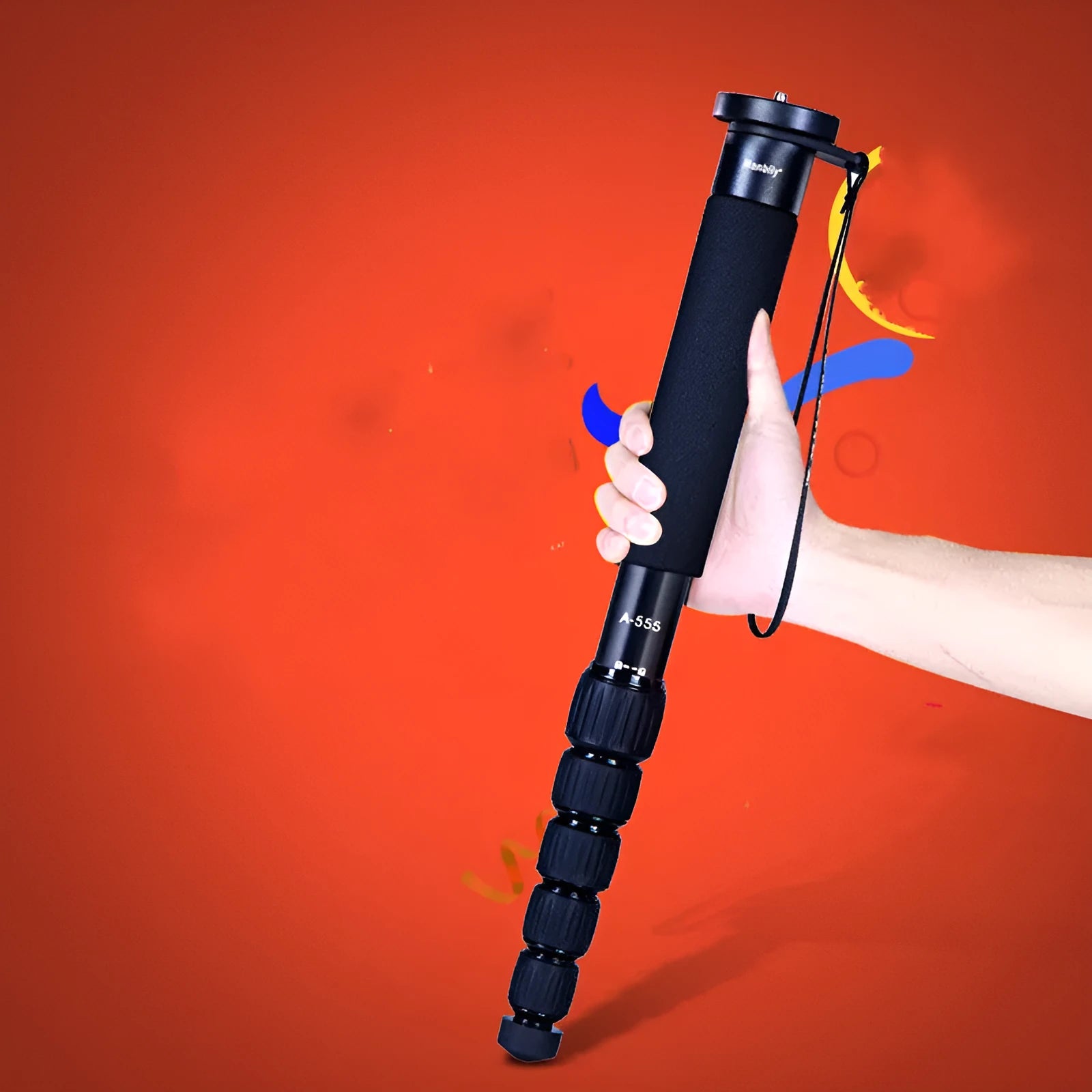 Manbily A-555 aluminium alloy camera monopod in black, extended to full height with three-prong stabiliser attached