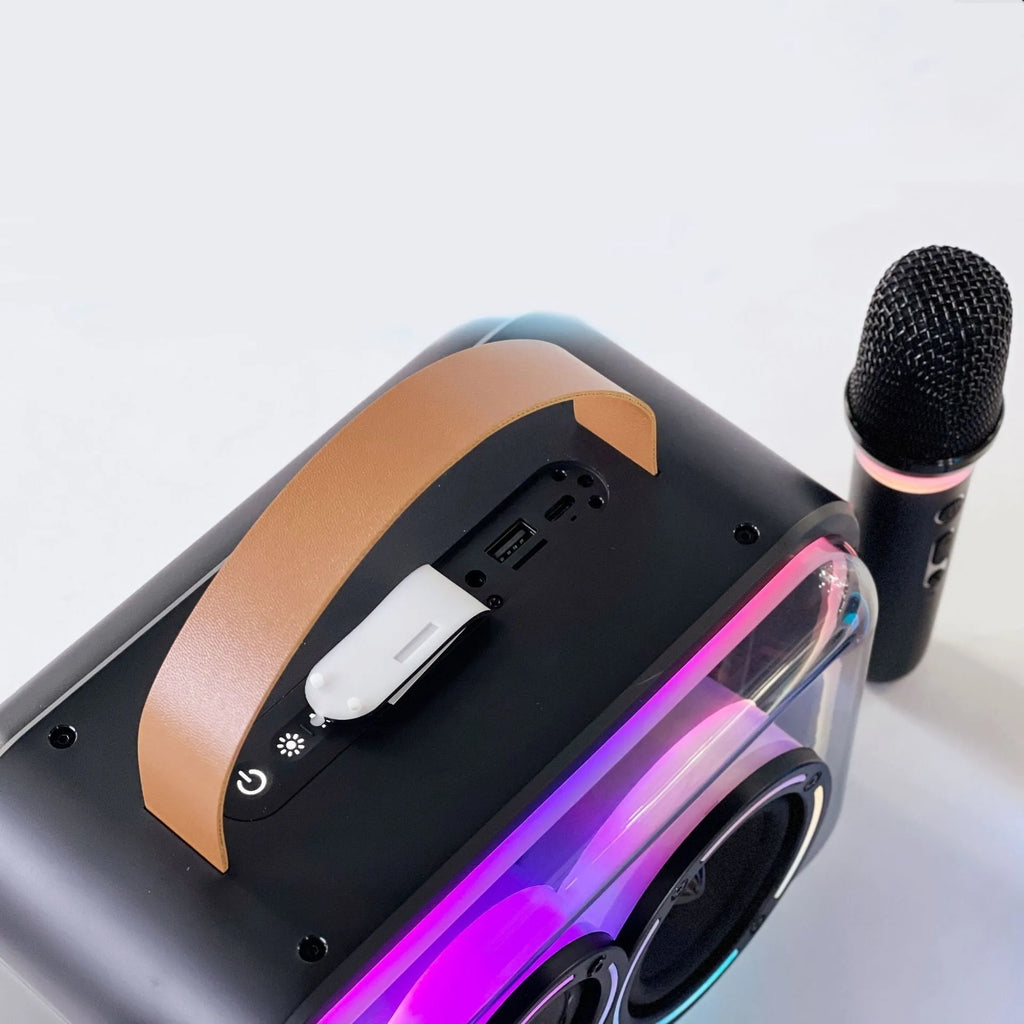 Light yellow and black portable Bluetooth karaoke speaker with RGB lights and microphone.