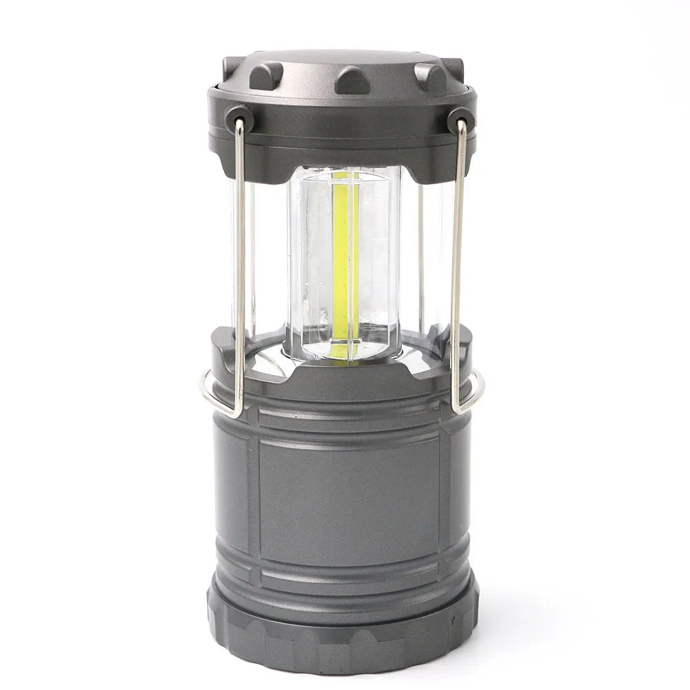 Gold COB camping lamp with telescopic design, solar panel on top, and stainless steel handle for hanging
