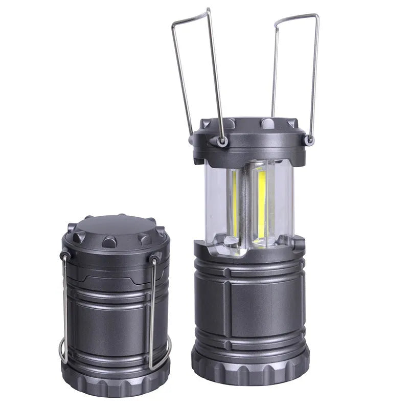 Gold COB camping lamp with telescopic design, solar panel on top, and stainless steel handle for hanging