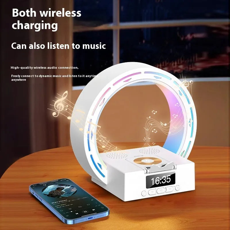 White multifunctional Bluetooth speaker with wireless charging pad, bedside lamp and digital clock display on wooden table