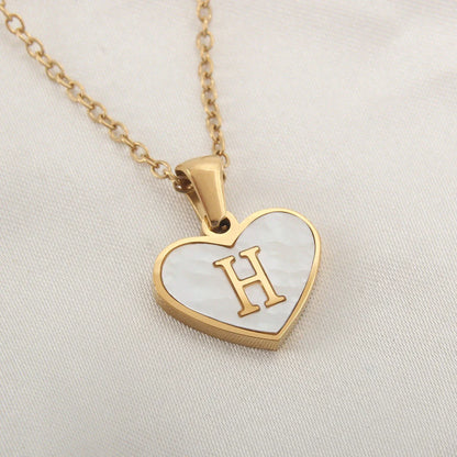 A personalized heart-shaped necklace with a 26-letter charm, crafted from high-quality stainless steel and gold plating.