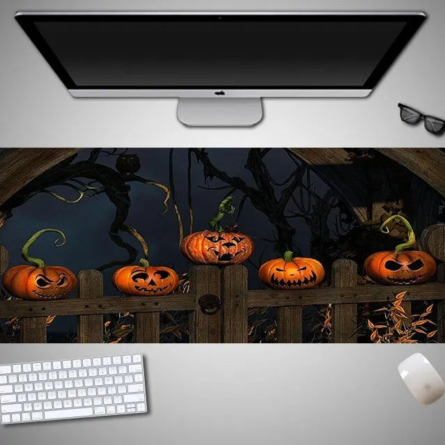 Oversized Halloween gaming mouse pad with non-slip rubber base on a desk