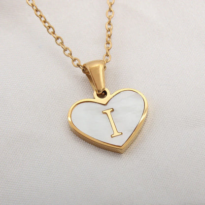 A personalized heart-shaped necklace with a 26-letter charm, crafted from high-quality stainless steel and gold plating.